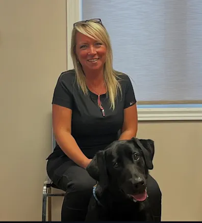 Heather posing next to a dog named Angues Heather posing next to a dog named Angues