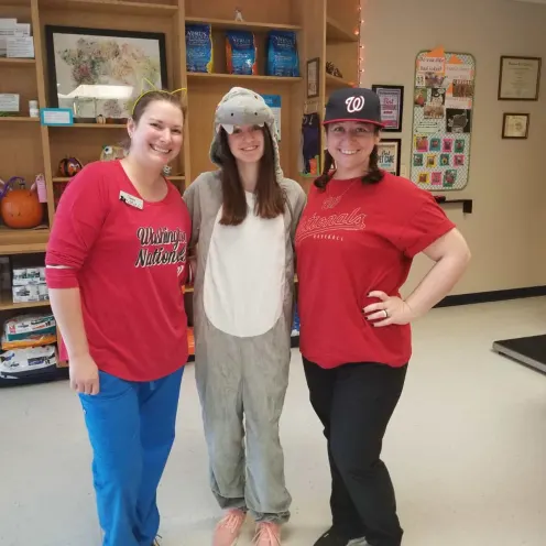 Staff dressed in sports and costume outfits