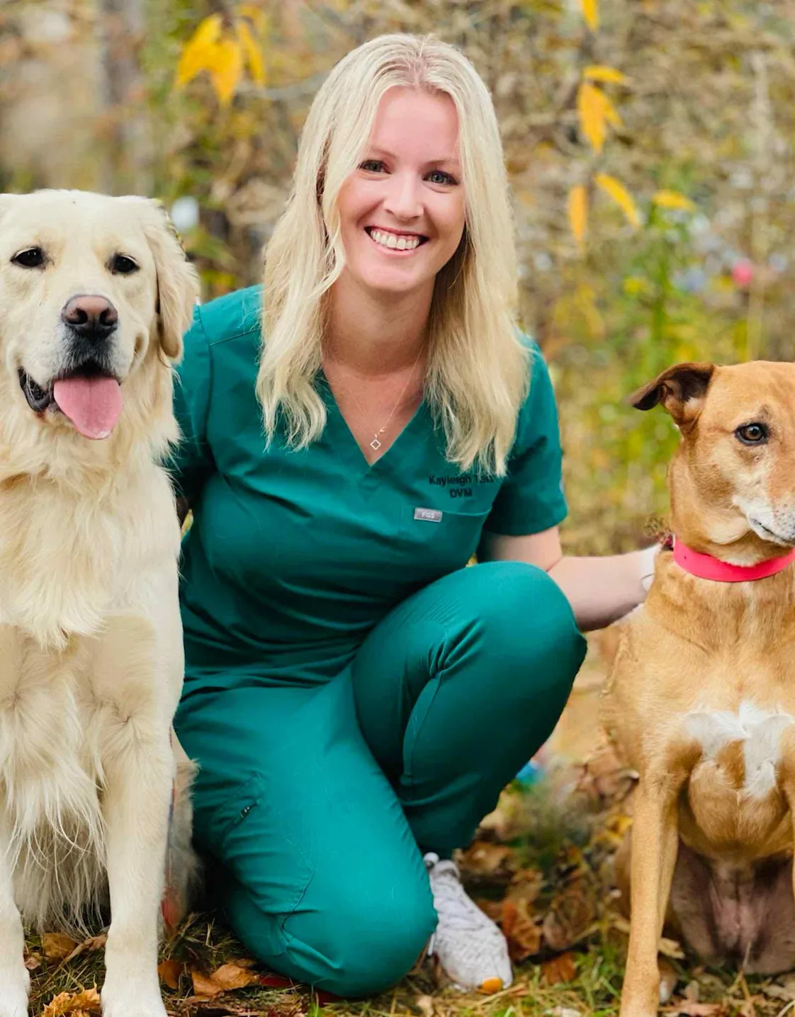 Dr. Kayleigh Tait with two dogs. Dr. Kayleigh Tait with two dogs.