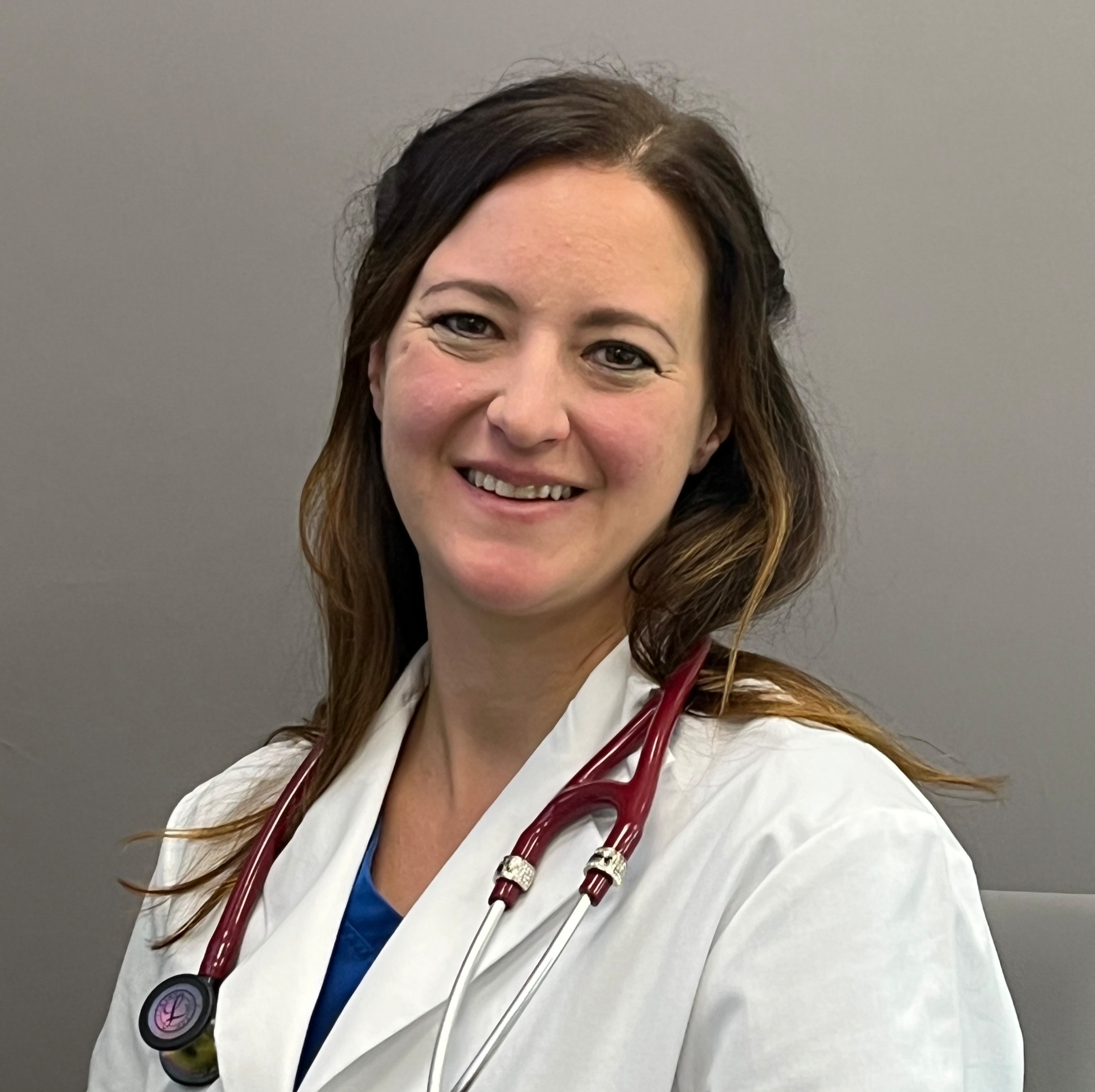 Rebekah Mayhew smiling for a photo. 