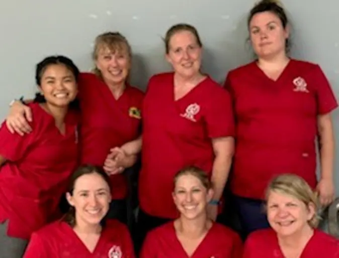 a group of Allandale's staff wearing red at Roatan Honduras a group of Allandale's staff wearing red at Roatan Honduras
