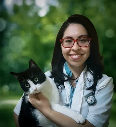 Dr. Susan Zamora holding a cat Dr. Susan Zamora holding a cat