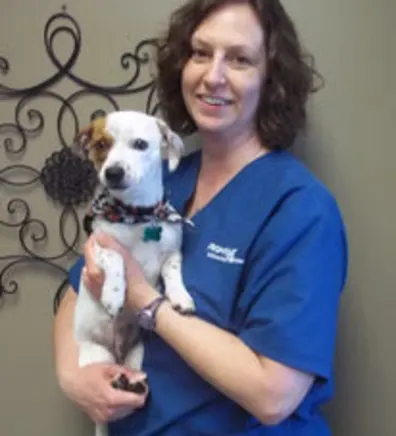 Ammie holding onto a small dog. Ammie holding onto a small dog.