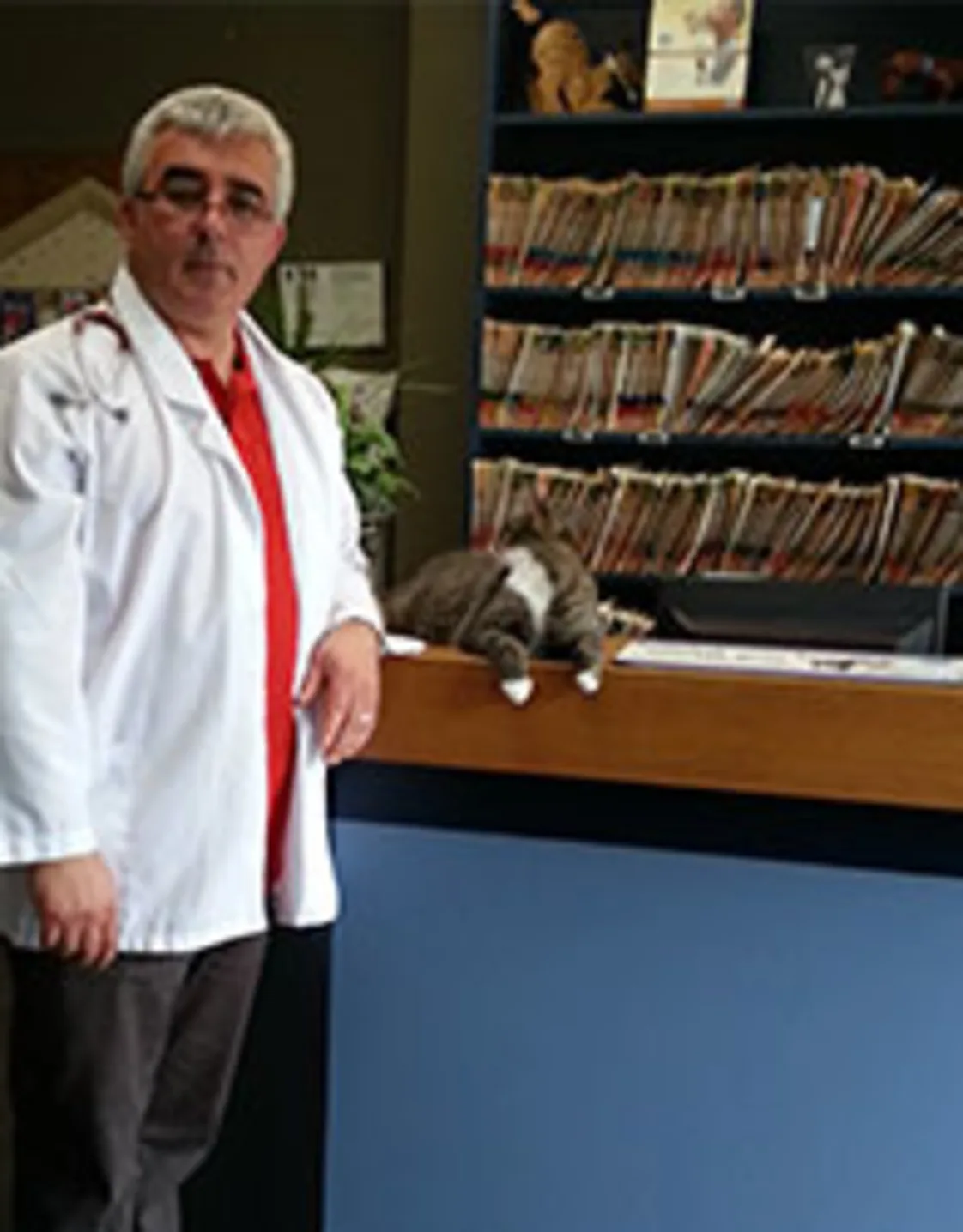 Dr. Ervin Harxhi with a cat Dr. Ervin Harxhi with a cat