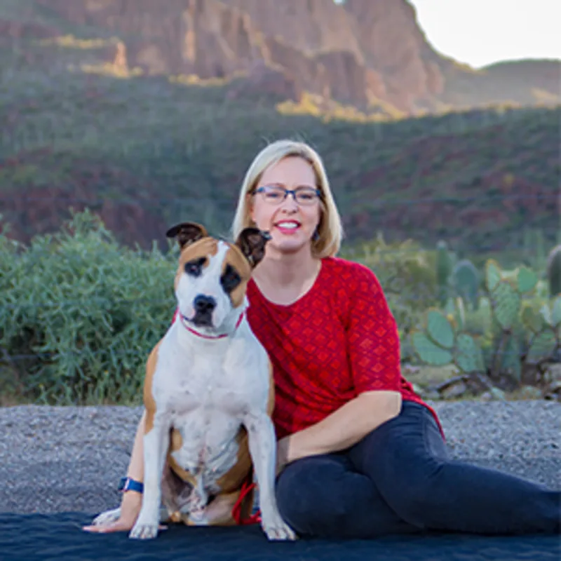 Beth Neuman sitting with tan and white dog Beth Neuman sitting with tan and white dog