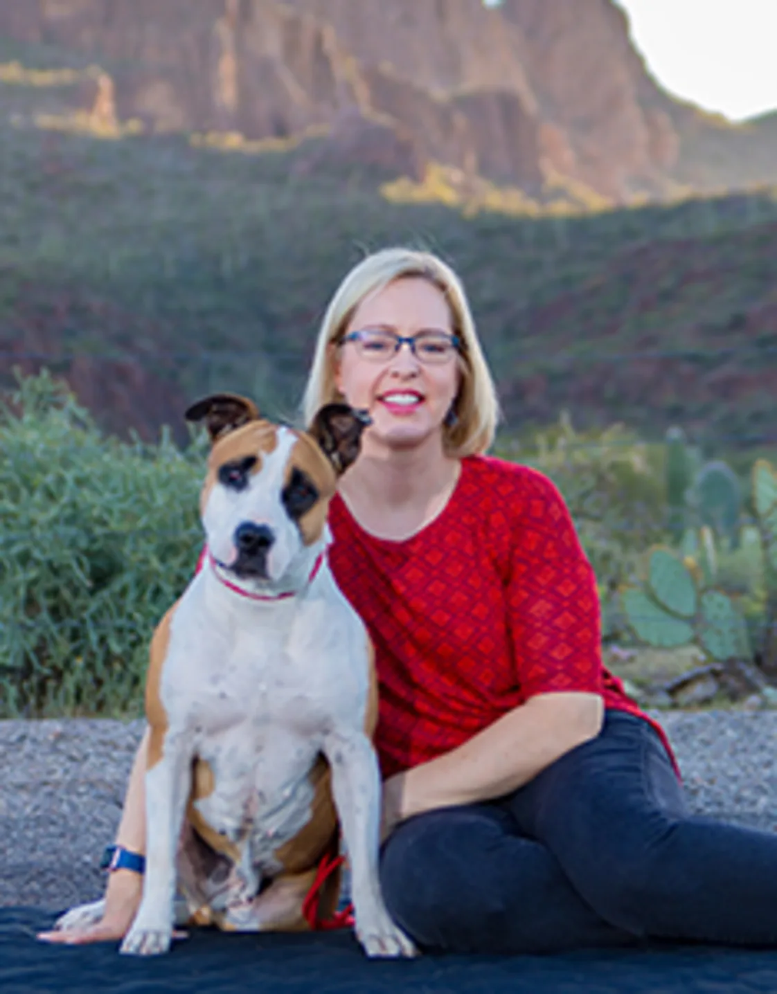 Beth Neuman sitting with tan and white dog Beth Neuman sitting with tan and white dog