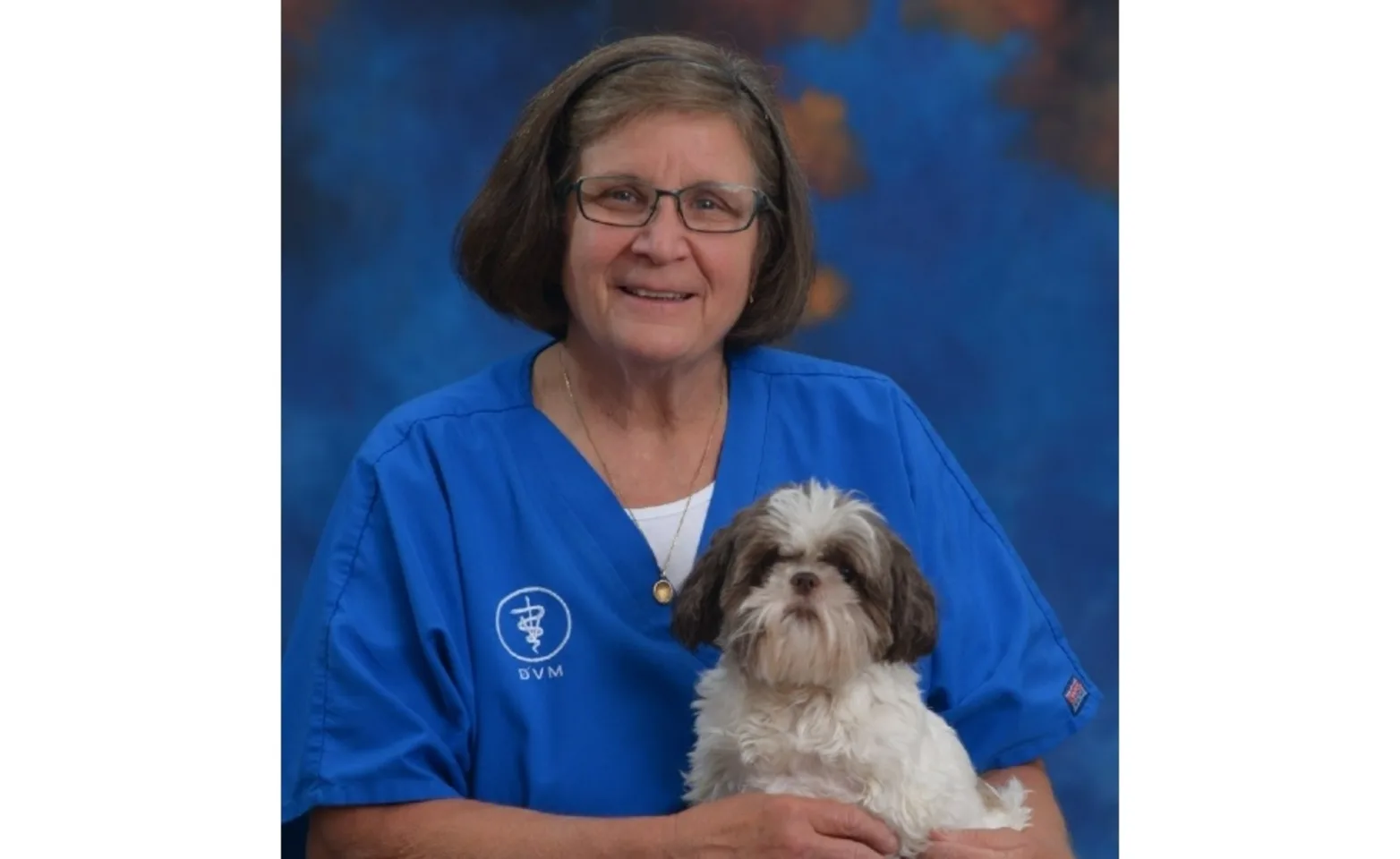 Dr. Jill holding a dog