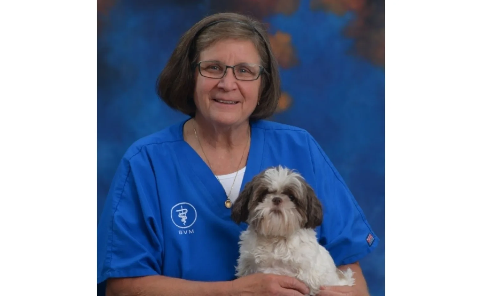 Dr. Jill holding a dog Dr. Jill holding a dog