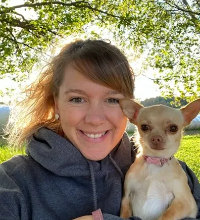 Brianna holding a small dog