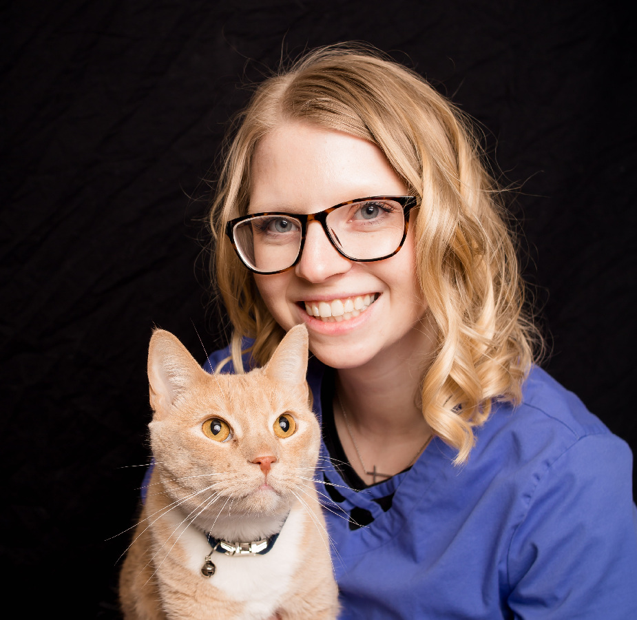 A Kindness Animal Hospital staff member with a cat