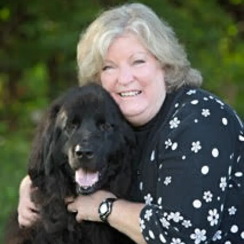 Dr. Gregg hugging a dog Dr. Gregg hugging a dog
