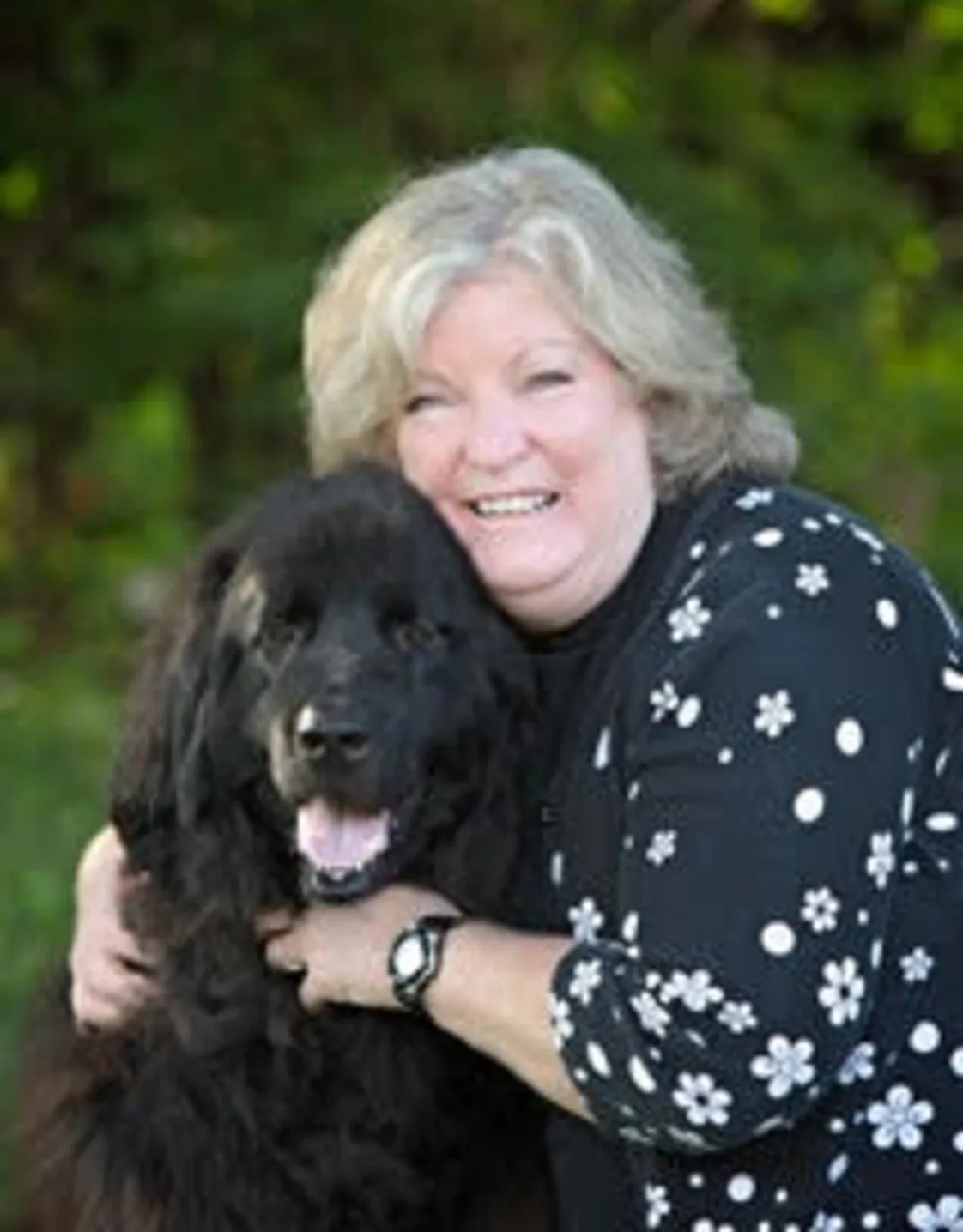 Dr. Gregg hugging a dog Dr. Gregg hugging a dog