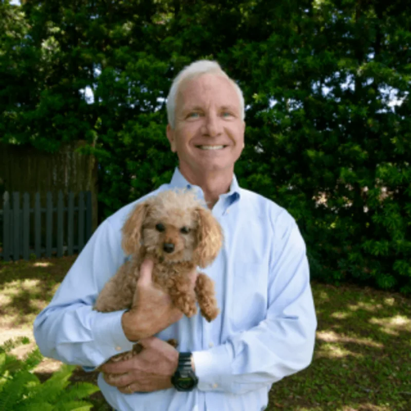 Chris Fabacher with a small puppy Chris Fabacher with a small puppy