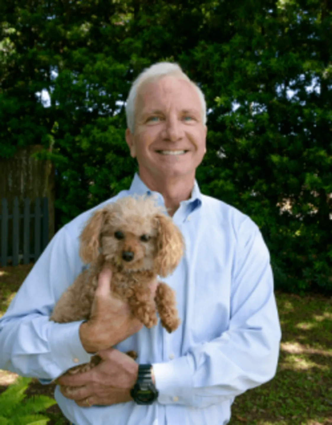 Chris Fabacher with a small puppy Chris Fabacher with a small puppy