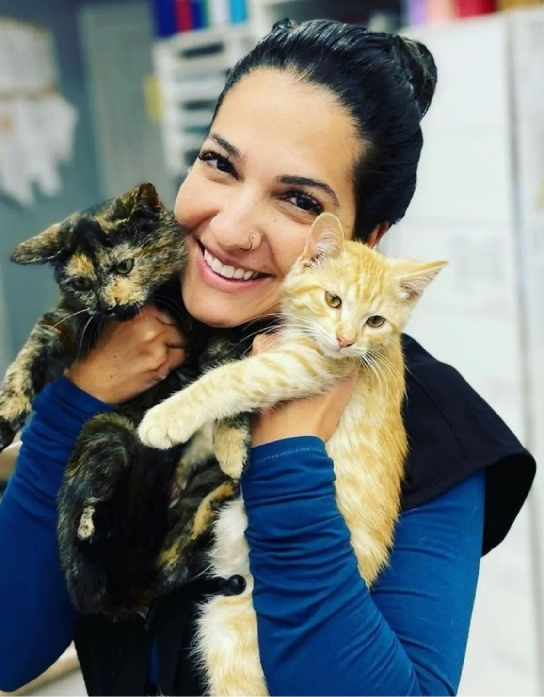 Dr. Alline Stinglin holding a cat Dr. Alline Stinglin holding a cat