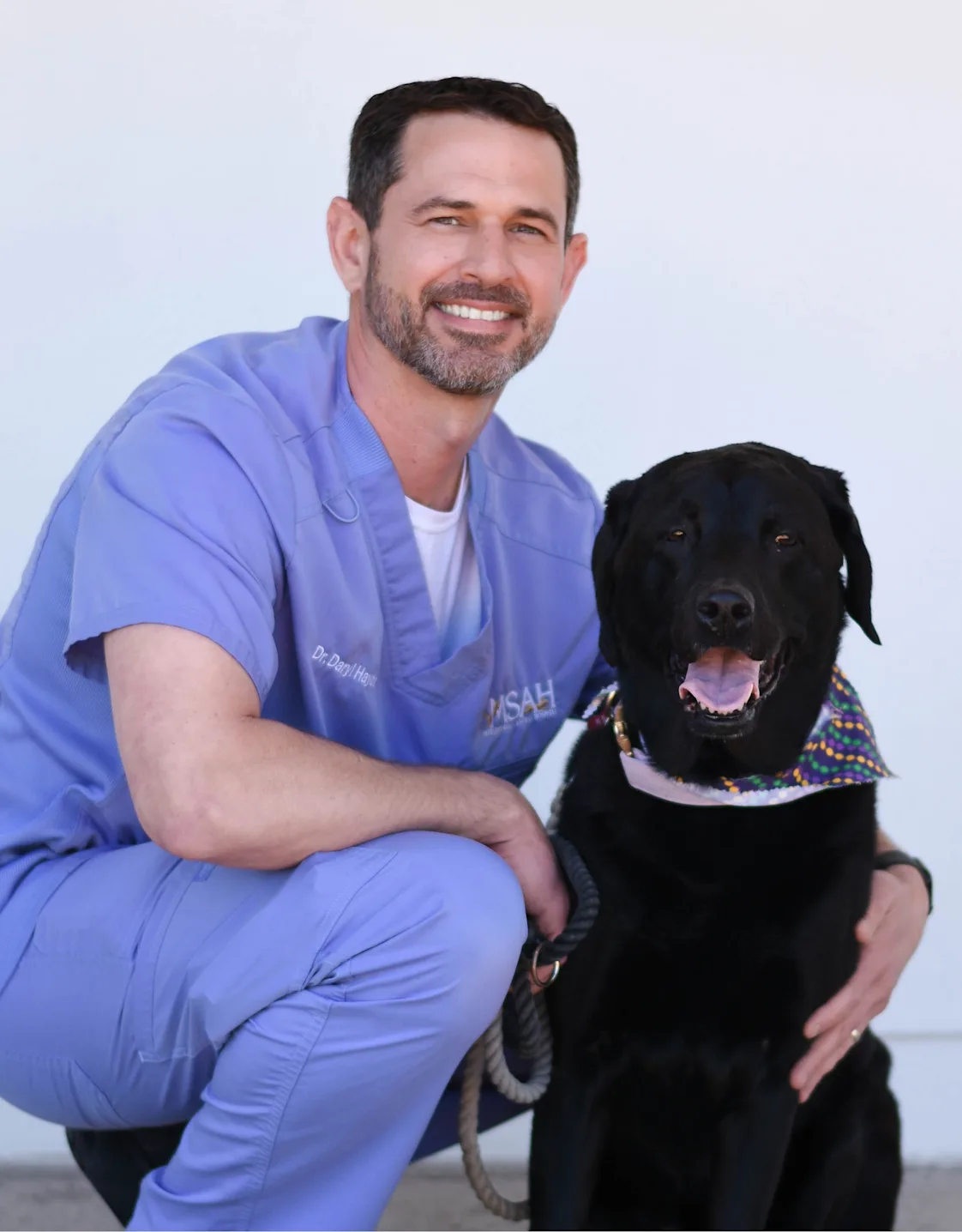 Daryl Haydel holding a small dog Daryl Haydel holding a small dog