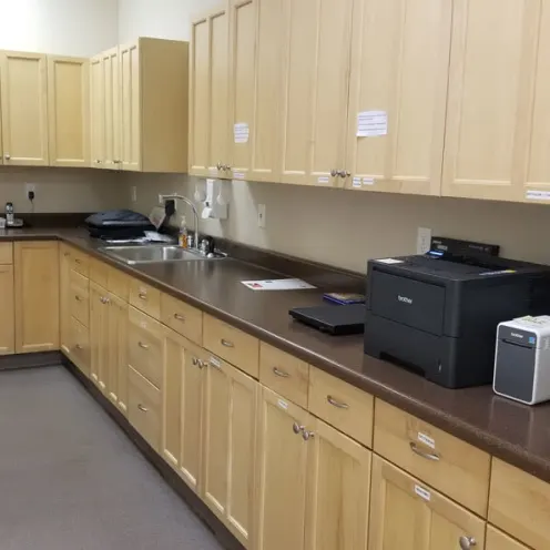 Large laboratory area with lots of storage cabinets at Central Coast Pet Emergency Clinic