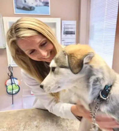 Dr. Briiann Dawson with a dog Dr. Briiann Dawson with a dog