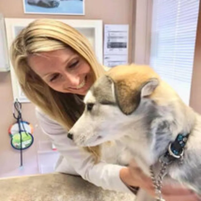 Dr. Briiann Dawson with a dog Dr. Briiann Dawson with a dog