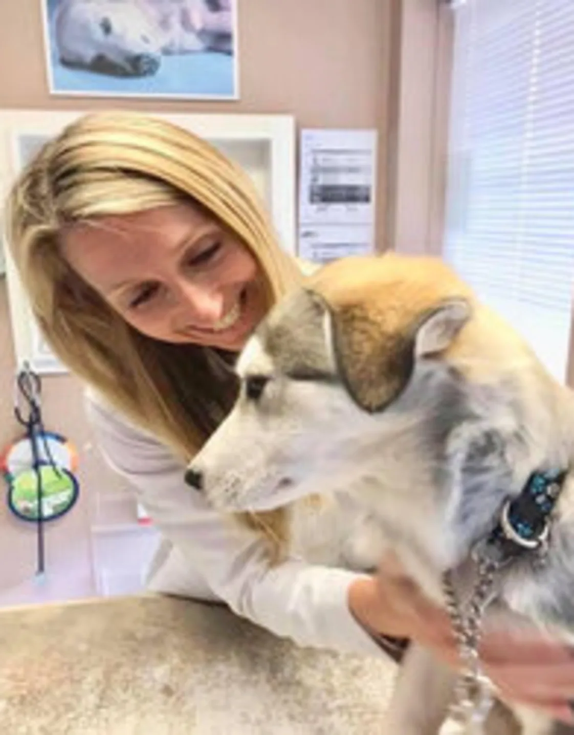 Dr. Briiann Dawson with a dog Dr. Briiann Dawson with a dog