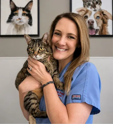 Lindsay C.'s staff photo from Spanish Trail Animal Hospital where she is outside in the front yard holding a fluffy brown dog in her arms. Lindsay C.'s staff photo from Spanish Trail Animal Hospital where she is outside in the front yard holding a fluffy brown dog in her arms.