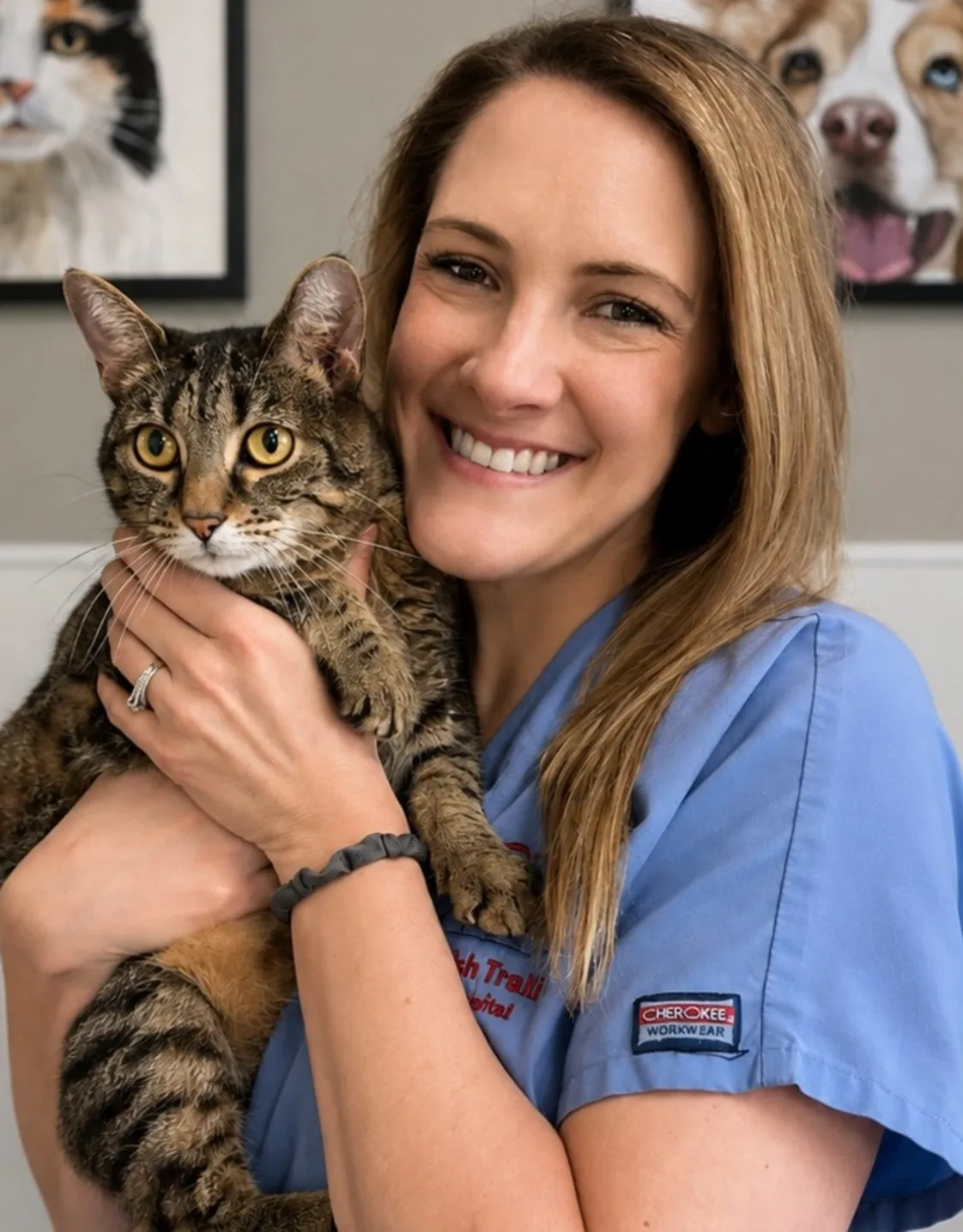 Lindsay C.'s staff photo from Spanish Trail Animal Hospital where she is outside in the front yard holding a fluffy brown dog in her arms. Lindsay C.'s staff photo from Spanish Trail Animal Hospital where she is outside in the front yard holding a fluffy brown dog in her arms.