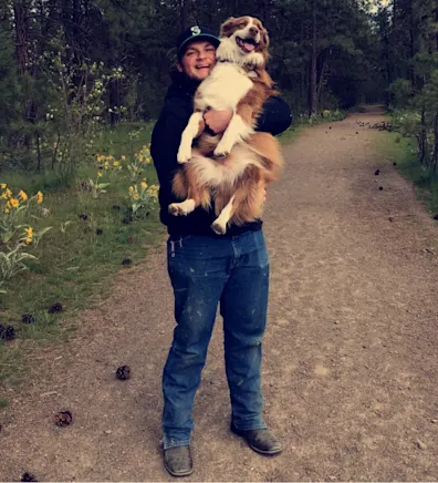 Zak Jones holding dog Zak Jones holding dog