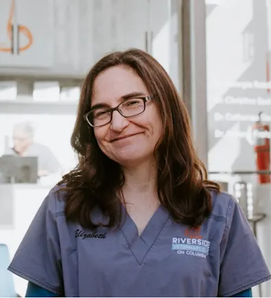 Elizabeth's staff photo from Riverside Animal Hospital South where she is holding a little yorkshire puppy Elizabeth's staff photo from Riverside Animal Hospital South where she is holding a little yorkshire puppy