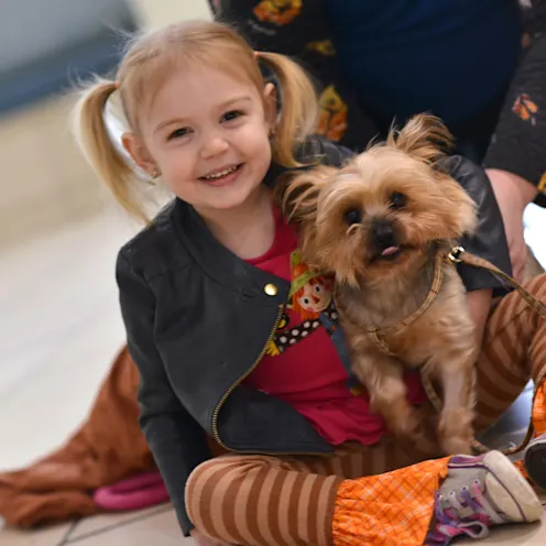 Little girl sitting with puppy Little girl sitting with puppy