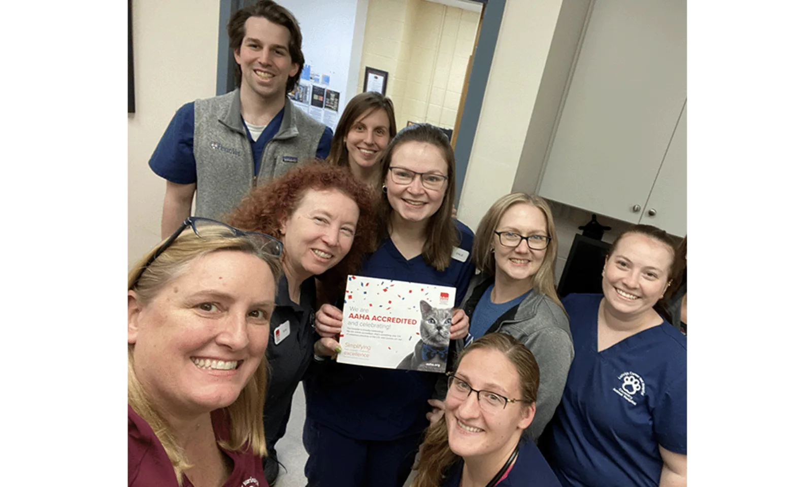Staff members holding an AAHA accreditation certificate Staff members holding an AAHA accreditation certificate
