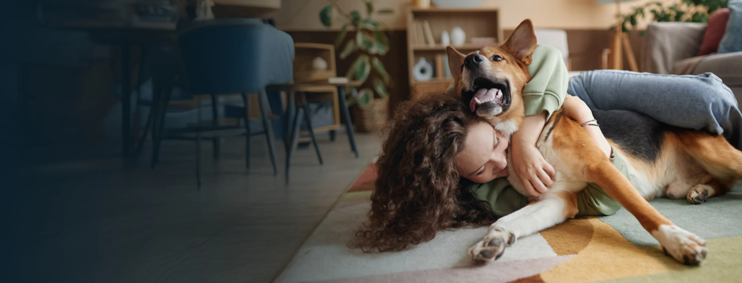 Woman Hugging Dog in Living Room Woman Hugging Dog in Living Room