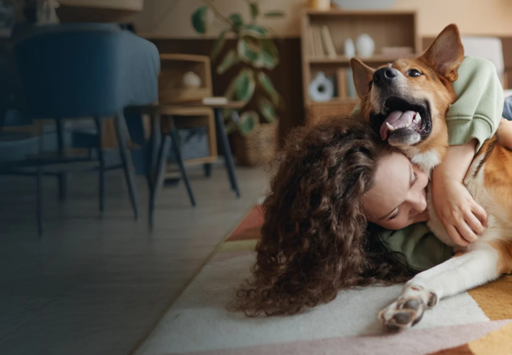Woman Hugging Dog in Living Room Woman Hugging Dog in Living Room