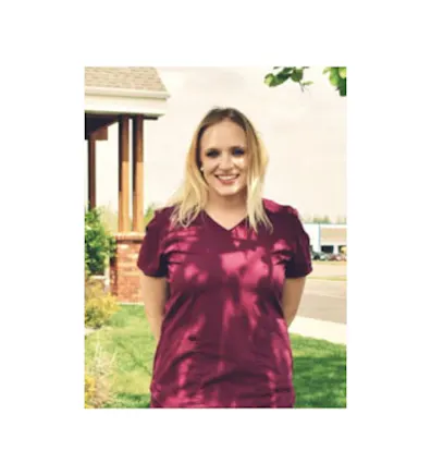 A photo of employee Samantha smiling outside of the hospital A photo of employee Samantha smiling outside of the hospital