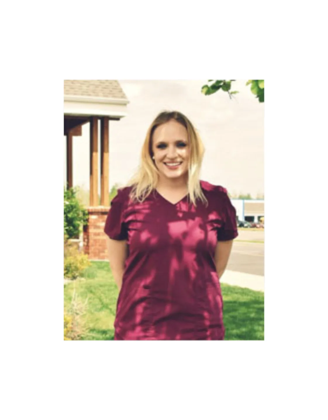 A photo of employee Samantha smiling outside of the hospital A photo of employee Samantha smiling outside of the hospital