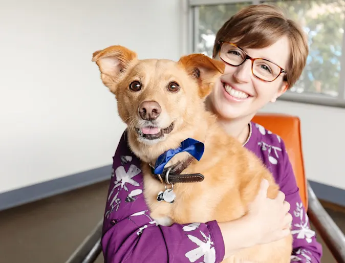 Smiling woman hugging a dog Smiling woman hugging a dog