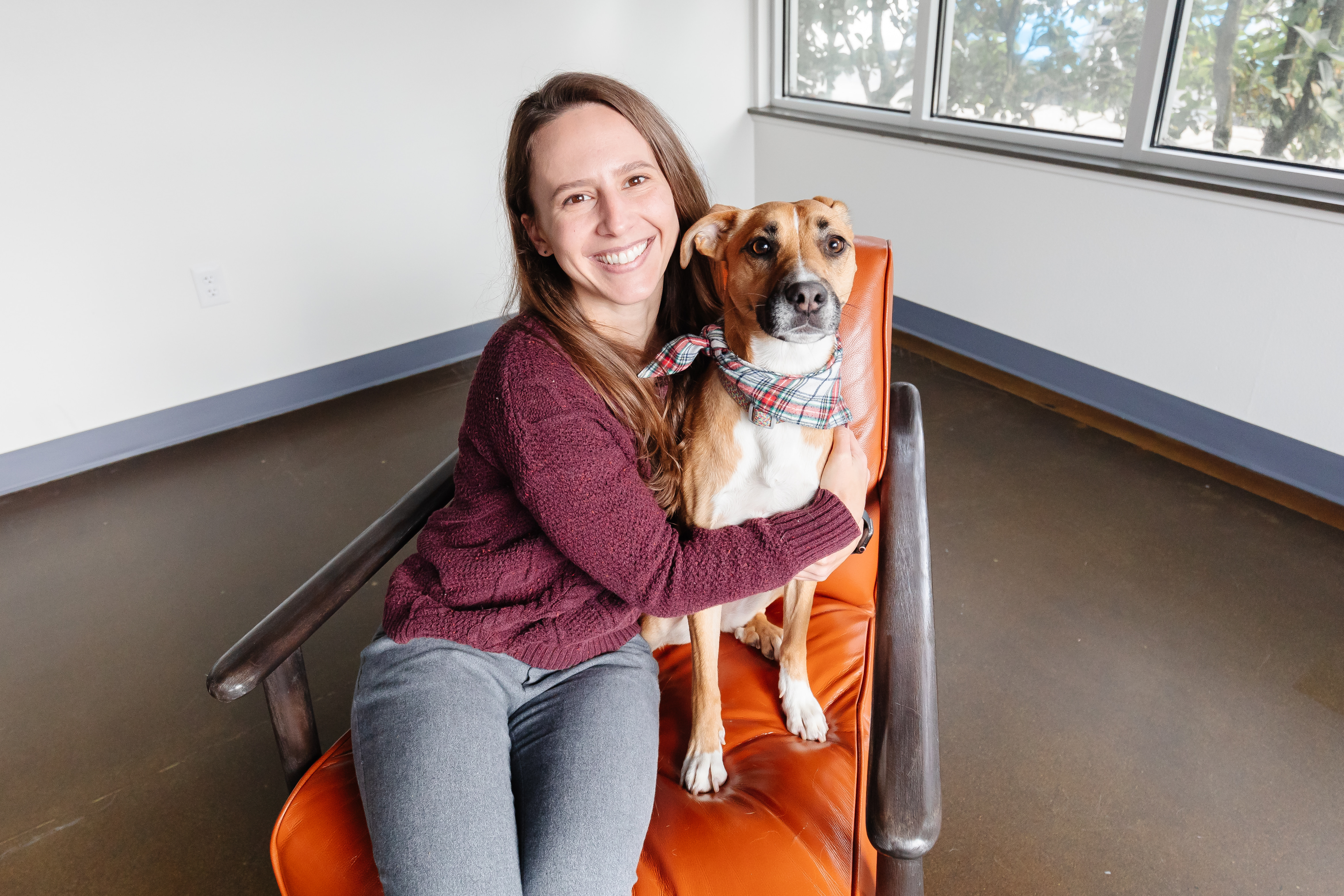 Smiling woman hugging a dog