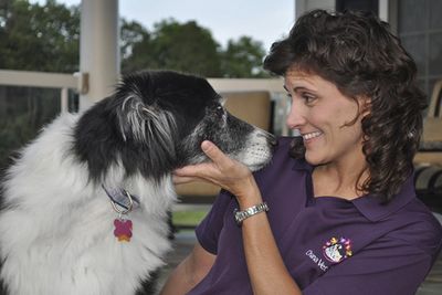 Woman smiling at dog