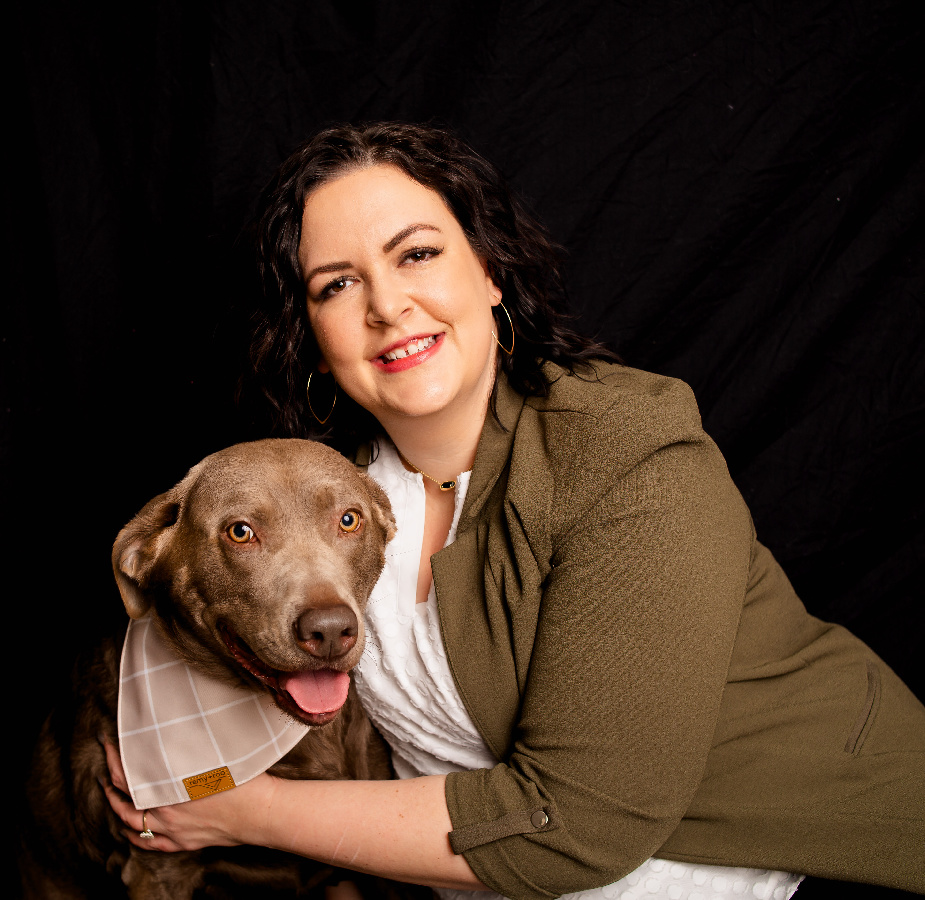 A Kindness Animal Hospital staff member with a dog