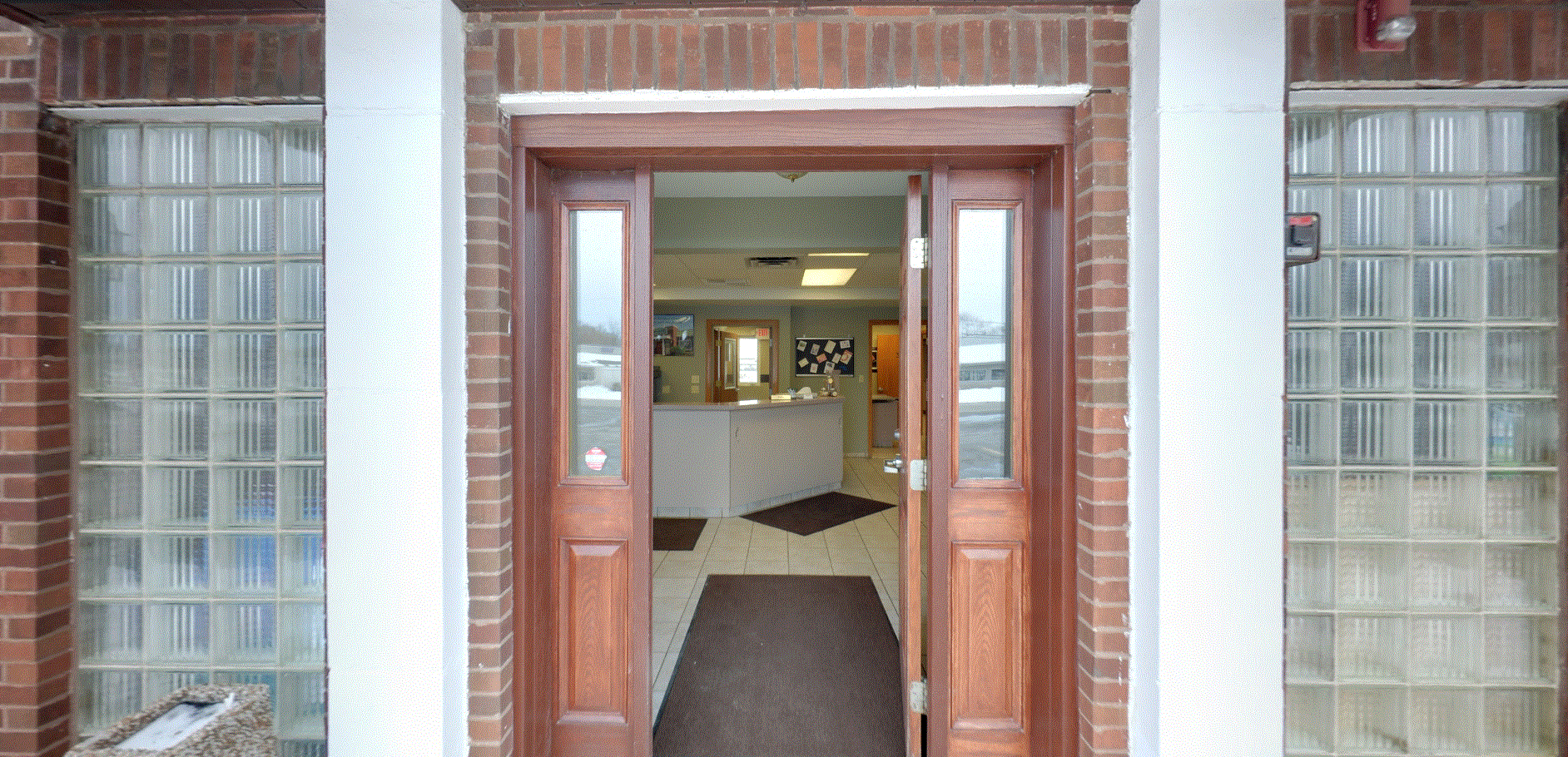 Peotone Animal Hospital Front Entrance Way that has a red brick entrance way