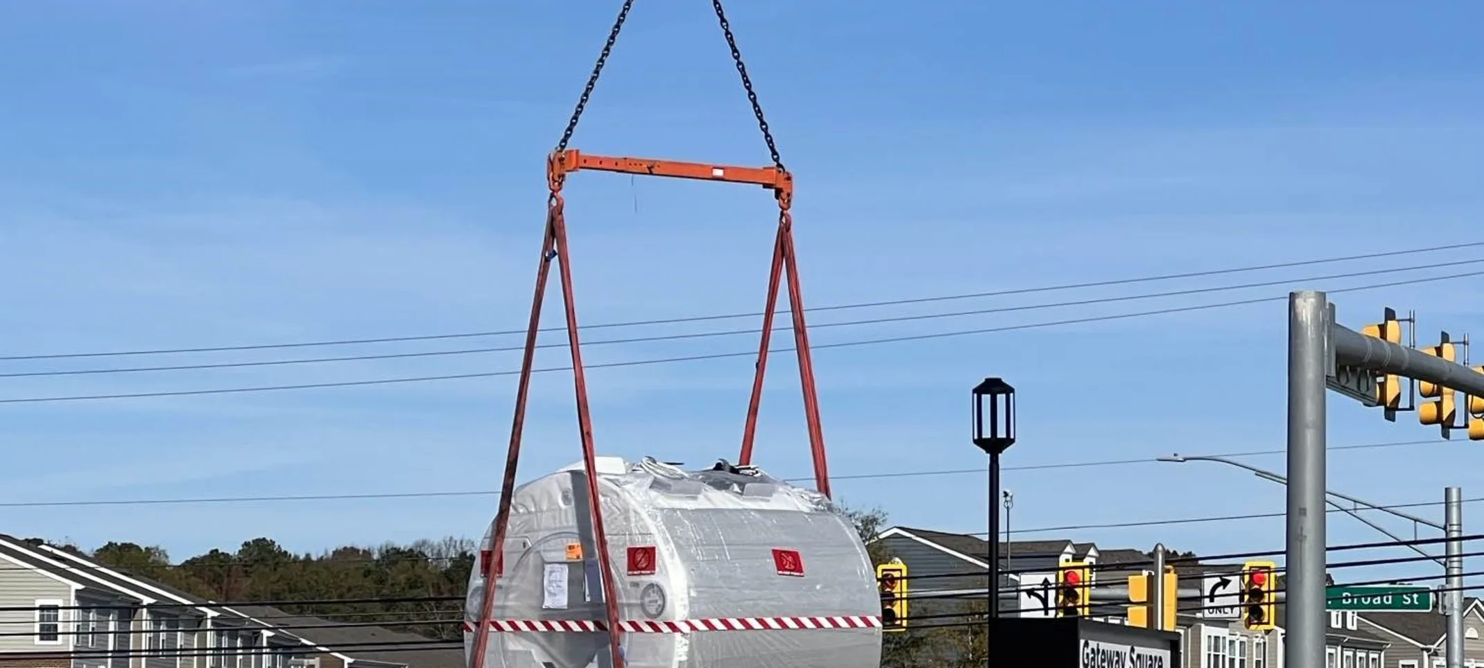 Construction crew using crane to move in MRI machine Construction crew using crane to move in MRI machine