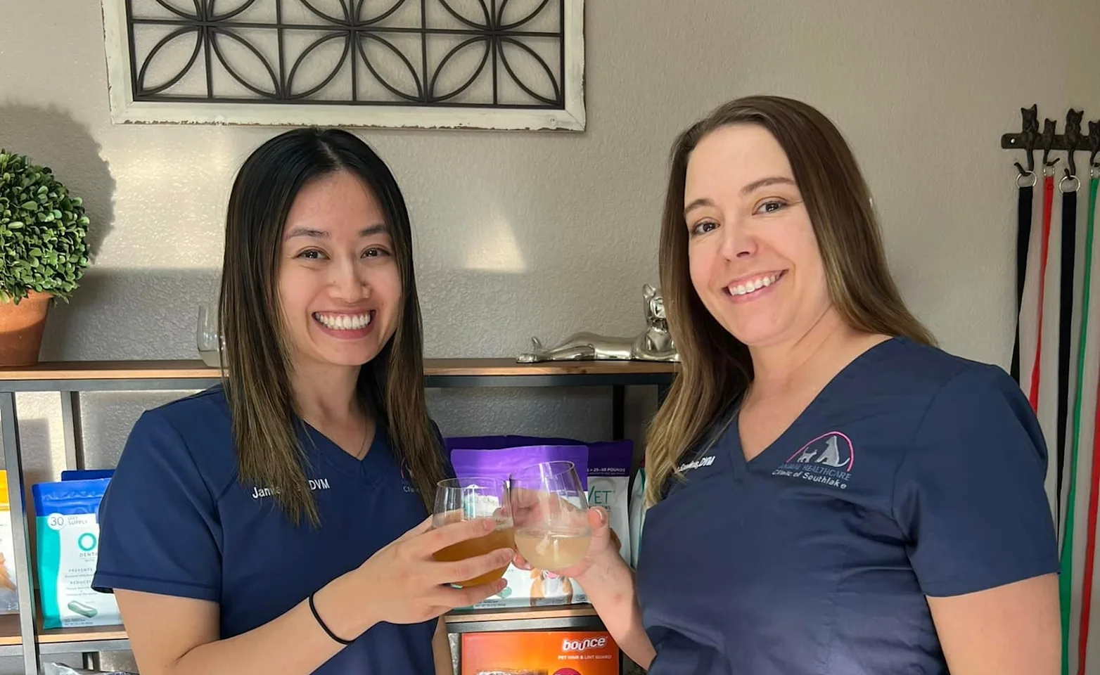 two veterinary staff posing