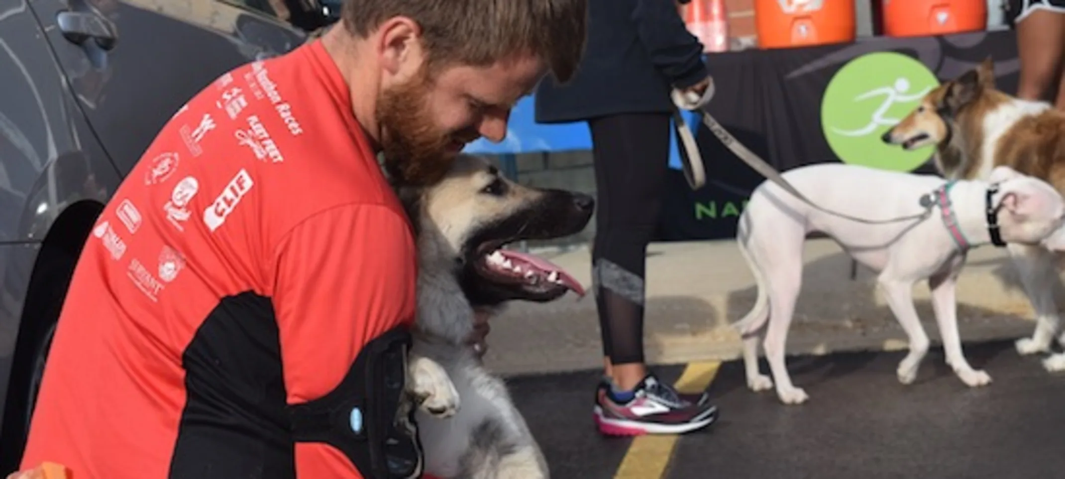 staff holding dog staff holding dog