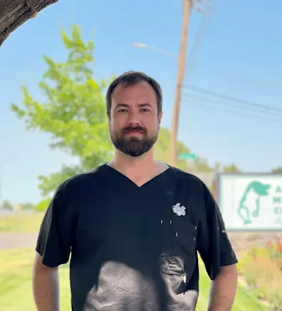 Zachary standing with 2 dogs. Zachary standing with 2 dogs.