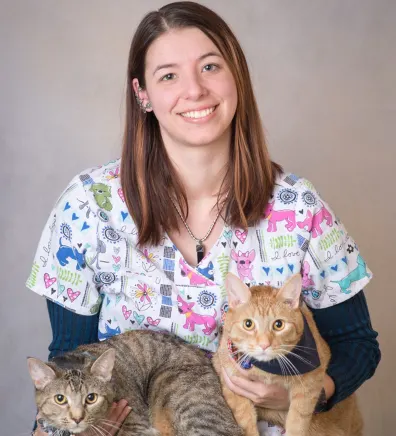 Brianna holding 2 cats
