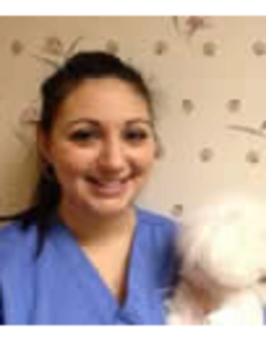 Maria Gatto's staff photo from Shinnecock Animal Hospital where she posing with a white dog in her arms. Maria Gatto's staff photo from Shinnecock Animal Hospital where she posing with a white dog in her arms.