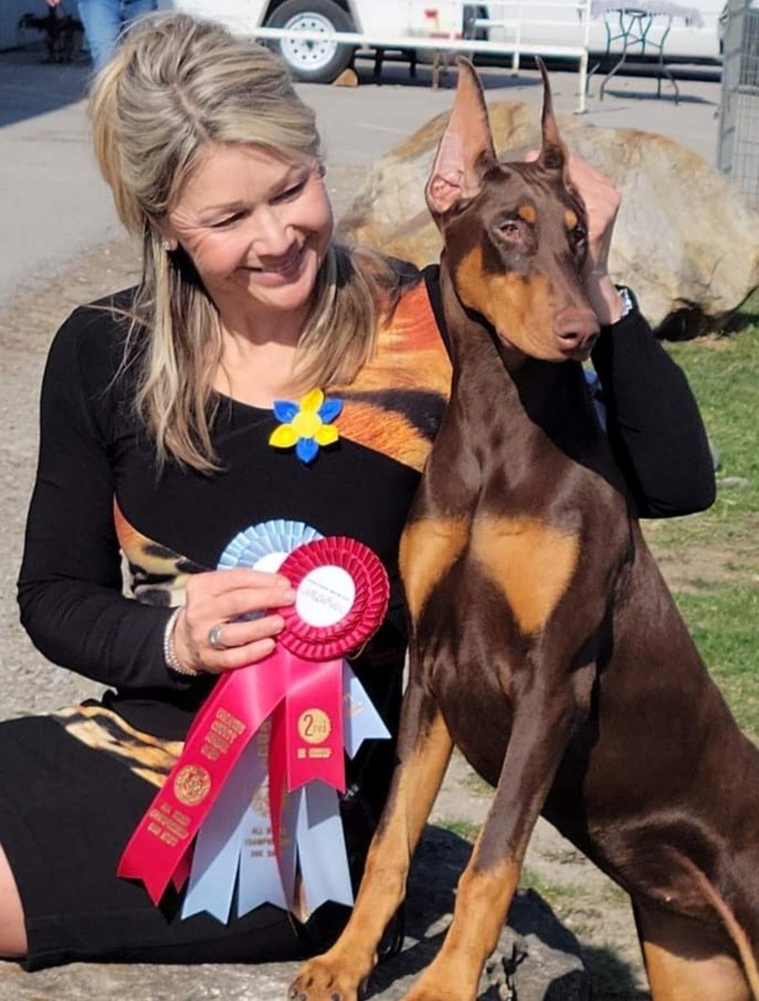 Sheryl from Three Islands Veterinary Services, with three dogs