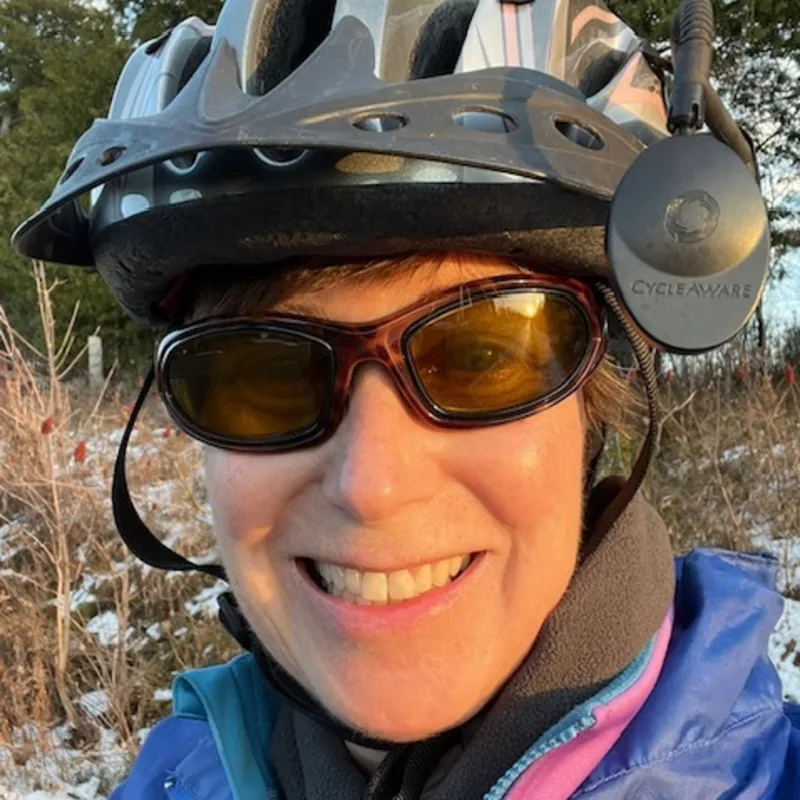 Dr. Heather wearing sunglasses and posing with her dog Dr. Heather wearing sunglasses and posing with her dog