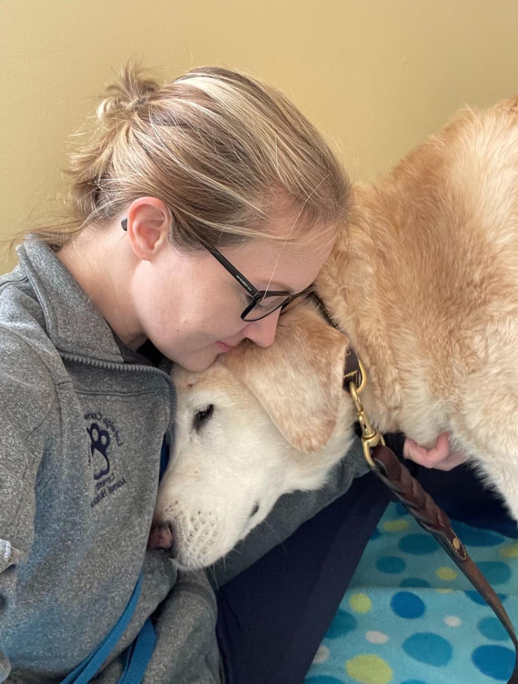 Arizona hugging a dog