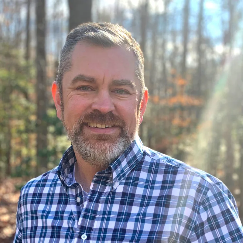Martin Young in a forest. Martin Young in a forest.