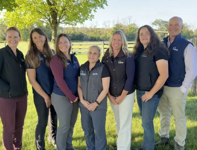 A photo of WECH staff standing in a field for a picture